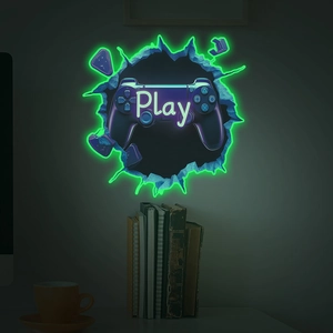 Glow-in-the-dark wall sticker of a game controller with neon green light and Play text