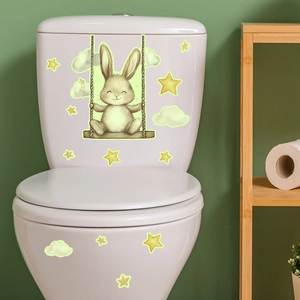 Vue détaillée de l'autocollant lapin lumineux sur un couvercle de toilette en céramique