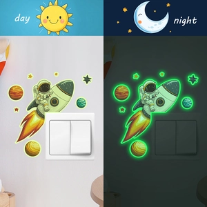 Luminous astronaut rocket wall stickers showing day and night glowing effect on light switch