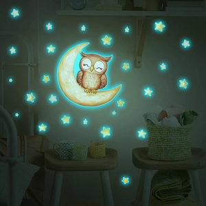 Glow-in-the-dark wall stickers featuring a smiling owl on a moon with stars for home decor