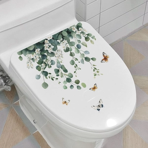 Floral toilet seat decal featuring green eucalyptus leaves and colorful butterflies