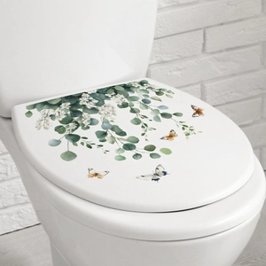 Floral toilet lid decals featuring watercolor green leaves and colorful butterflies decor