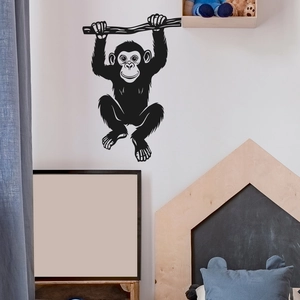 Black chimpanzee silhouette wall sticker hanging on a branch for bedroom home decor