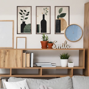 Modern Nordic 3-piece floral wall art set with abstract leaves in wooden frames