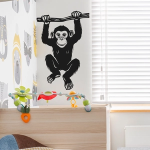 Chimpanzee hanging on tree branch wall decal for modern nursery and living room decor