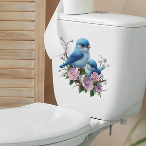 Self-adhesive floral wall sticker with blue birds and pink flowers on bathroom toilet