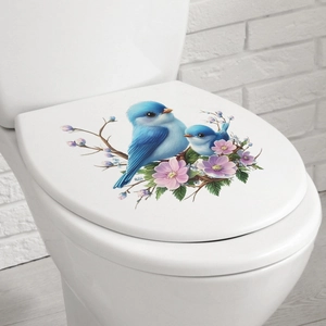 Self-adhesive toilet lid sticker with blue birds and purple flowers on white seat