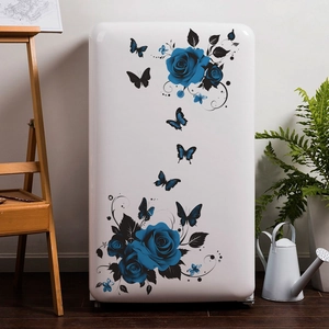 Blue rose and black butterfly wall stickers on a white fridge in a creative home setting