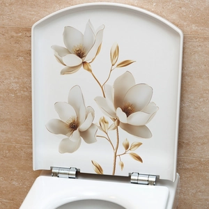 Detail of white magnolia floral wall sticker with gold accents on bathroom wall tiles
