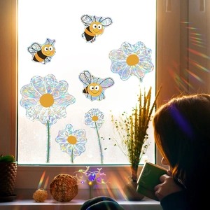 Detailed holographic window decal showing cartoon bee and flower with rainbow prism light effect
