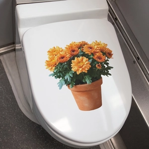 Vivid orange potted chrysanthemum sticker applied on a white toilet lid surface