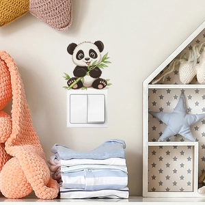 Cute panda holding bamboo wall sticker for switch decoration in a cozy nursery room setting