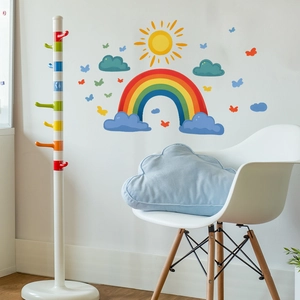 Cartoon rainbow and sun wall decal for nursery with colorful clouds and butterflies