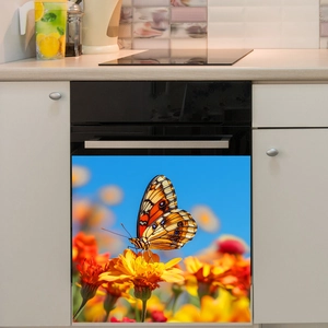 Vibrant butterfly and orange flower decal applied on a black kitchen dishwasher door