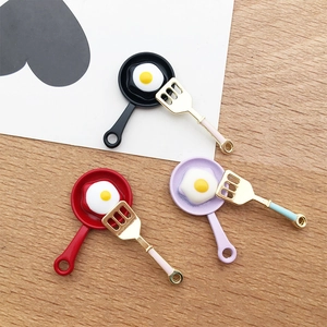 Three creative frying pan and spatula charms for DIY jewelry making in various colors
