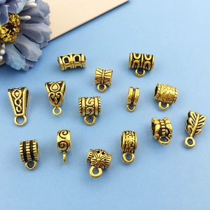 Diverse vintage gouden hangerogen en connectoren voor DIY armbanden en sieraden