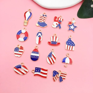 Flat lay of red, white, and blue enamel alloy American Independence Day charms