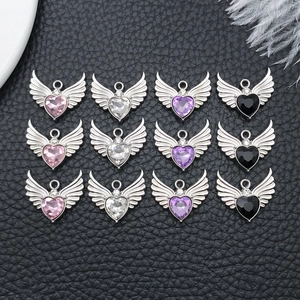 Collection of crystal heart pendants with silver angel wings in four different colors