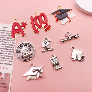 Assorted graduation alloy charms featuring doctoral caps, diplomas and A plus scores