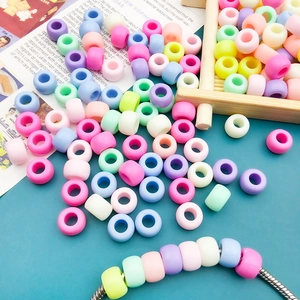 Macro detail of macaron-colored acrylic large hole beads for DIY creative jewelry crafting