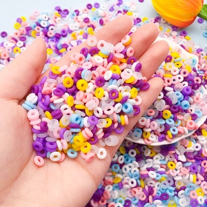 Close-up of colorful 6mm silicone beads held in hand for DIY jewelry making