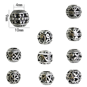Antique silver alloy hollow round beads 10mm with floral patterns for jewelry making