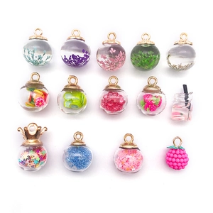 Mini glass bottle charms with colorful sequins and dried flowers for DIY jewelry making