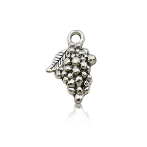 Macro shot of silver vintage grape-shaped alloy pendant charms for DIY jewelry making