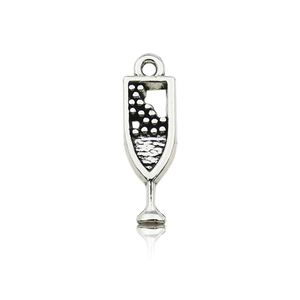 Macro view of vintage silver champagne glass charm with detailed bubble texture and top ring