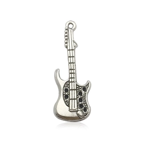 Detail of vintage silver electric guitar pendant with fine string textures and top ring