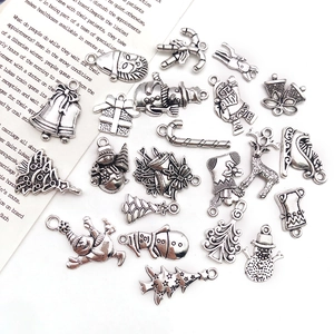Macro view of silver alloy Christmas charms set for DIY jewelry making and craft