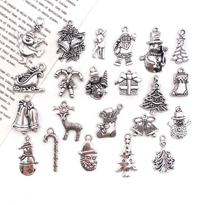 Macro view of assorted Christmas alloy pendants for DIY jewelry making in antique silver