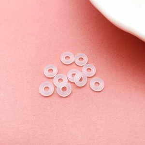 Macro shot of 10 small translucent silicone O-rings for jewelry and earring stoppers