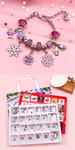 Close-up of Christmas 24-day advent calendar with purple DIY beaded charms and gift box