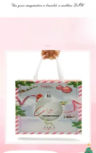 Bolsa de regalo navideña rosa con motivos de renos y asas de cinta blanca para joyería DIY