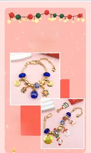 Detail of Christmas DIY bracelet with blue glass beads and snowflake charms on white stand
