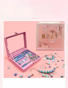 Pink velvet jewelry box with blue DIY beads, pendants, and matching gift bag set