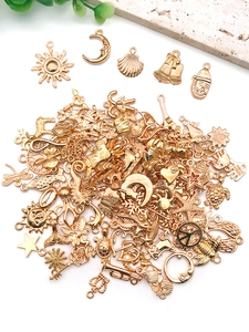Detailed collection of assorted light gold DIY alloy charms including sun and moon motifs