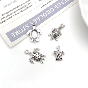 Set of vintage silver turtle pendants for DIY jewelry making with turtle shell texture