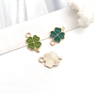 Detailed macro view of colorful enamel four-leaf clover charms for DIY jewelry making