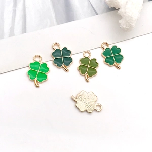 Green enamel four-leaf clover charms in various shades with gold-plated metal alloy backing