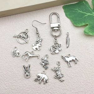 Vintage silver animal pendants including elephant and cat charms for DIY jewelry making