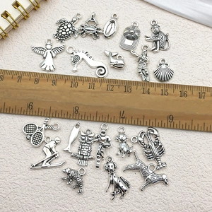 Mixed set of antique silver alloy animal pendants for DIY jewelry making with ruler guide