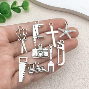 Vintage silver alloy DIY charms set featuring scissors, cross, and tiny tools for jewelry making