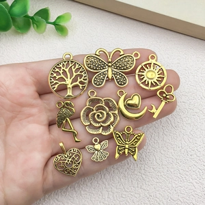 Set of 10 vintage gold alloy butterfly and tree pendants for DIY jewelry making