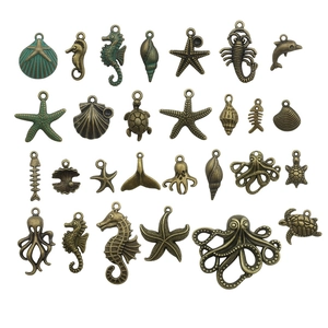 Vintage bronze ocean charms set featuring sea turtle starfish and shell pendants