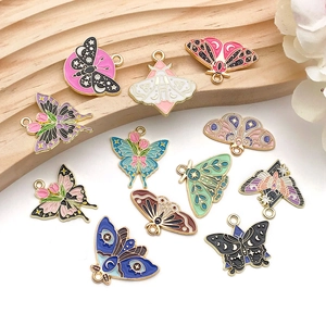 Collection of colorful butterfly and moth enamel charms for DIY jewelry making