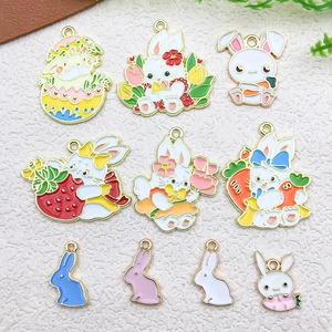 Detailed view of colorful rabbit enamel pendants with gold-plated edges for DIY jewelry