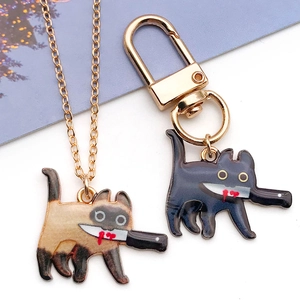 Gold cat pendant necklace and keychain charms with funny knife design in enamel finish