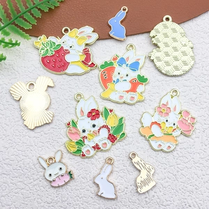 Detail showing assorted cartoon bunny enamel charms for DIY jewelry making in gold alloy